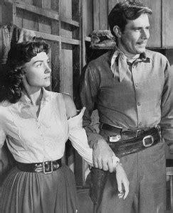 Donna Reed as Jennifer Ballard and Philip Carey as Frank Slayton in Gun ...