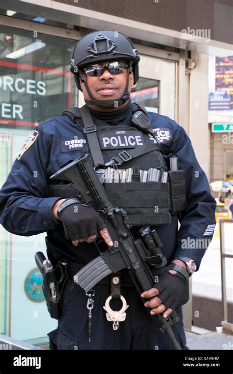 NYPD unit Anti-terrorism counterterrorism Police officers carrying machine guns in Times Square ...