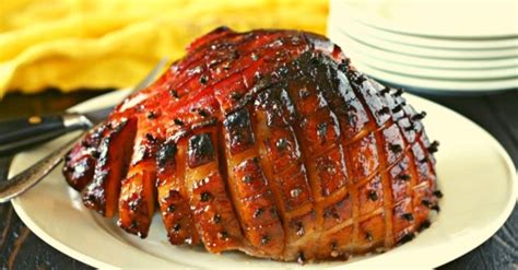 a plate topped with meat covered in bbq sauce