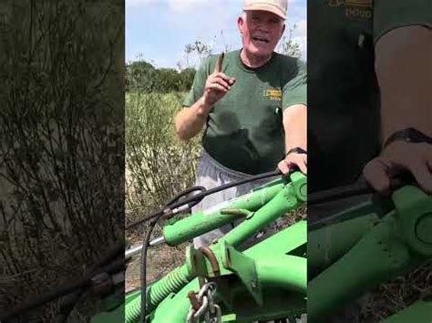 Replacing belt on a John Deere hay cutter - YouTube