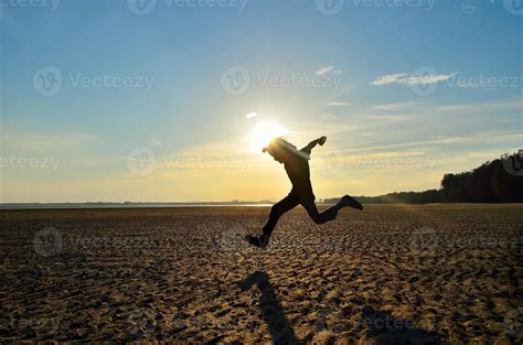 Silhouette of kid running on beach at sunset 3257467 Stock Photo at ...