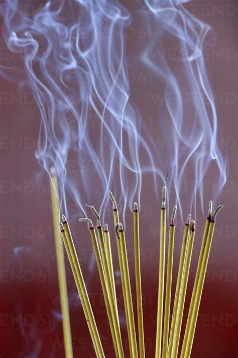 Incense sticks on joss stick pot burning, smoke used to pay respect to the Buddha, Vung Tau ...