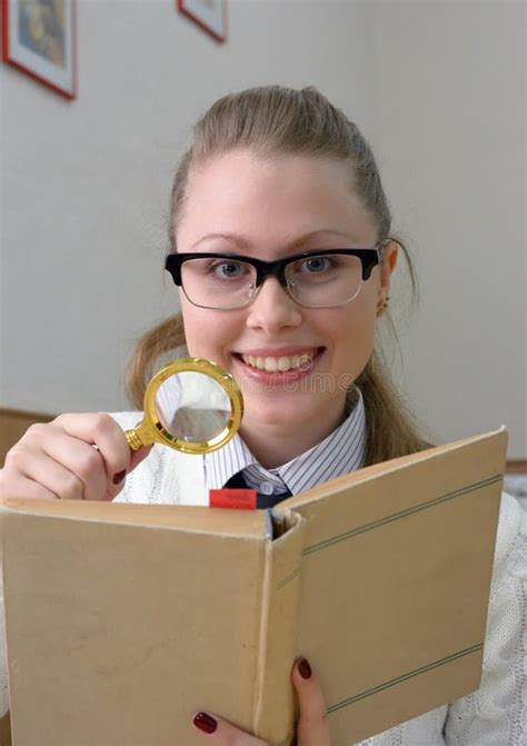 Woman Reading a Book with Magnifying Glass Stock Photo - Image of optics, concept: 27889538