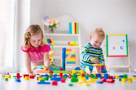 Kids playing at day care stock image. Image of childcare - 72024295