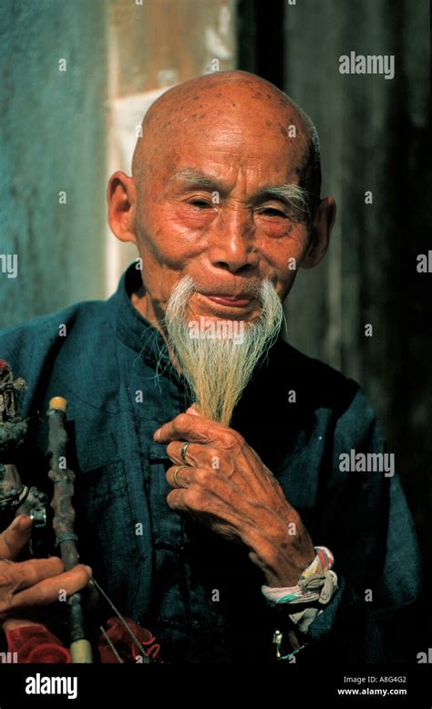 smiling old man stroking his beard, Yangshuo, China Stock Photo ...