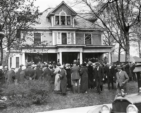 Mourners gather outside the home of Madge Oberholtzer, a white American woman whose rape and ...