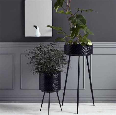 Black planters on a stand availble in three sizes.Small planter: Picture 2 Medium planter ...