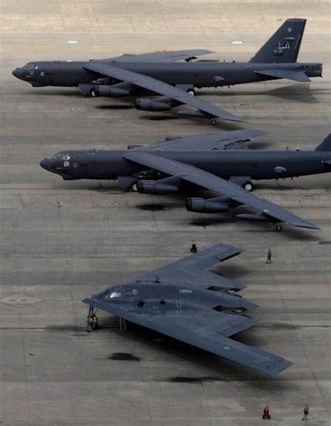 three fighter jets parked on top of an airport tarmac next to another ...