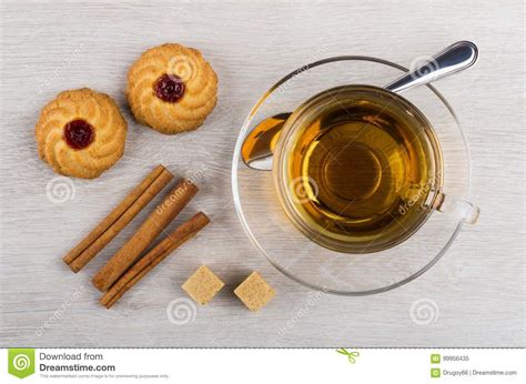 Cup of Tea, Teaspoon, Curabe, Cinnamon Sticks and Sugar Stock Image - Image of saucer, food ...