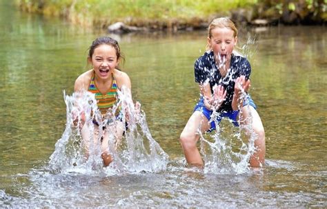 Children Splashing In Water - Stock Photo - Dissolve