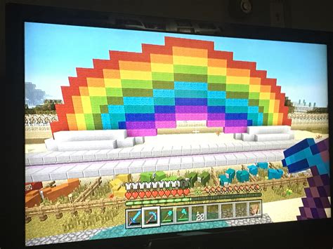 Made a rainbow above my multicolored sheep farm in survival! : r/Minecraft