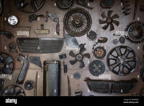 Set of old car parts on the wall in workshop Stock Photo - Alamy