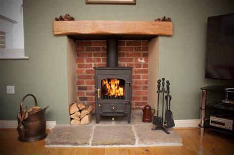 Photos of stoves in traditional recessed style fireplaces | Wood ...