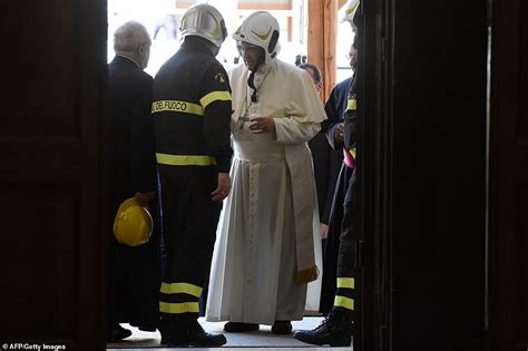 Pope Francis dons a firefighter's hard hat as he visits a damaged cathedral in Camerino | Daily ...