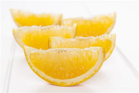 Orange Wedges on White Background Photograph by Colin and Linda McKie