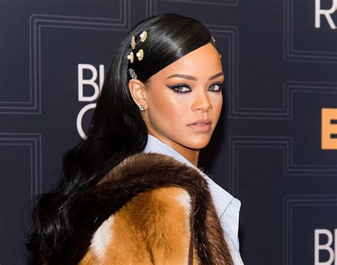 Do you think Rihanna's bold contrasting makeup and sleek hairstyle ...