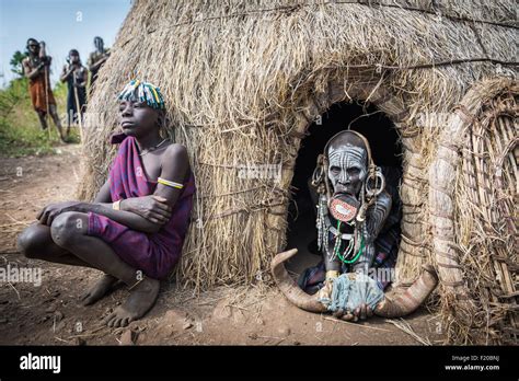 JINKA, ETHIOPIA, - 19 AUGUST 2015:unidentified women from Mursi tribe with big lip Plate, in ...