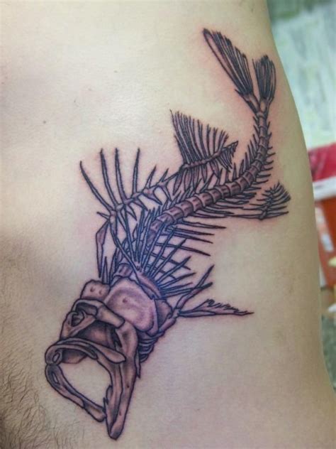 Fantastic fish skeleton tattoo | Bone tattoos, Type tattoo, Circle tattoos