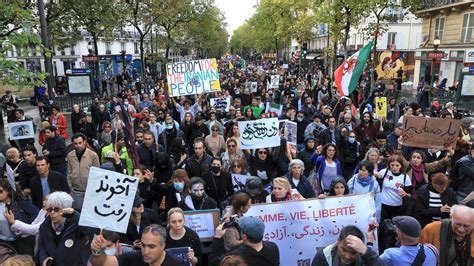 'Woman. Life. Freedom': Thousands march in Paris to back Iran anti ...