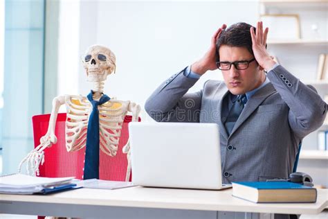 The Businessman Working with Skeleton in Office Stock Photo - Image of ...