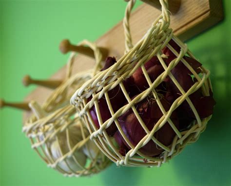 Hanging garlic basket in woven cane by wove on Etsy https://www.etsy.com/listing/25582855 ...