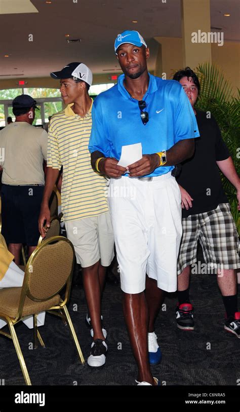 Alonzo Mourning (R) and his son Alonzo Mourning III ("Trey") (L) attend Summer Groove Golf ...