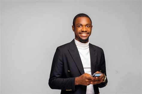 Premium Photo | Portrait of a young African American business man using ...