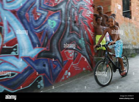 Favela children on bicycle and graffiti, Rio de Janeiro, Brazil, South America Stock Photo - Alamy