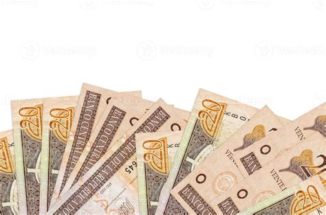 20 Dominican peso bills lies on bottom side of screen isolated on white background with copy ...