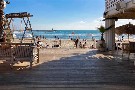 Tel Aviv,Israel , MAY 15, 2022. Outdoor beach restaurant with people ...