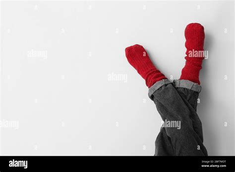 Legs of little child in socks and jeans on light background Stock Photo ...