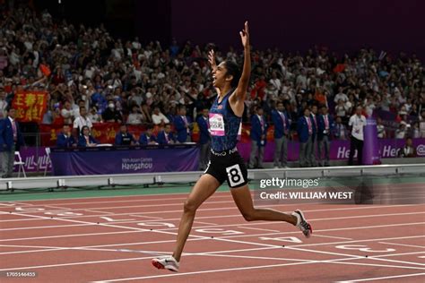 Sri Lanka's Tharushi Karunarathna crosses the finish line to win the... News Photo - Getty Images