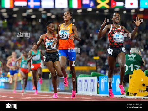 Faith Kipyegon, of Kenya celebrates as she wins the gold medal ahead of Sifan Hassan, of the ...