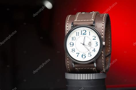 Mens watches with wide leather bracelet Stock Photo by ©kopitin 68334075