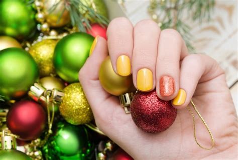 Free Photo | Beautiful female hand with perfect golden and pink nail ...