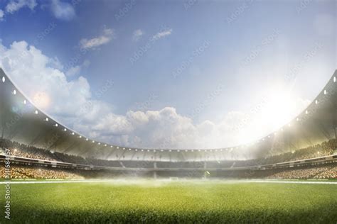 Childrens are playing soccer on grand arena Stock Photo | Adobe Stock