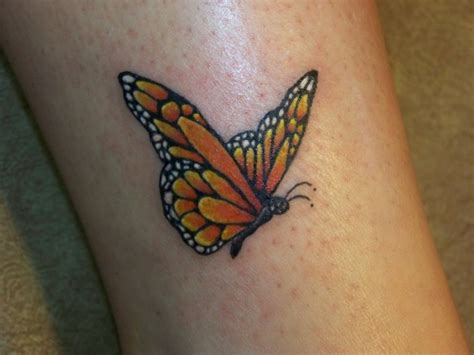 Amazing yellow small butterfly tattoo on leg - Tattooimages.biz