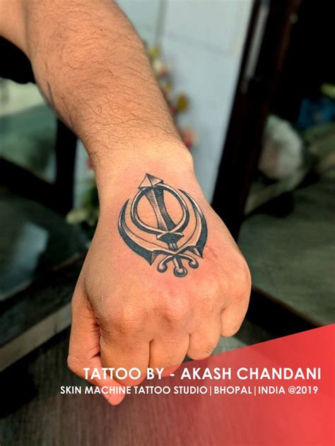 Khanda tattoo | Tattoo studio, Tattoos, Wrist band tattoo