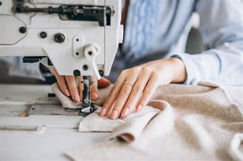 Woman tailor working at the sewing factory Photo | Free Download