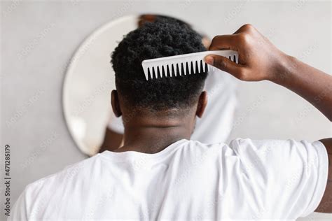 Black Man Brushing Hair