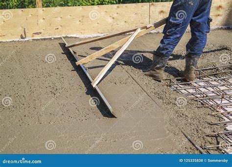 Worker Leveling Fresh Concrete Slab with Special Working Tool Stock Photo - Image of exterior ...