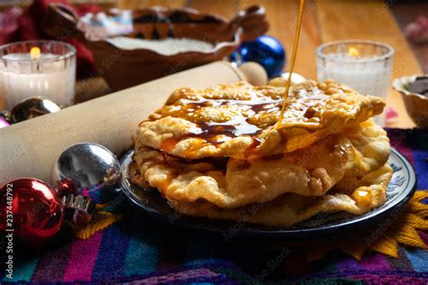 Mexican buñuelos with piloncillo syrup Stock Photo | Adobe Stock