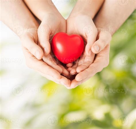 Couple hands holding a heart together 786988 Stock Photo at Vecteezy