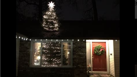 20 foot Christmas tree cut in half; appears to go through roof