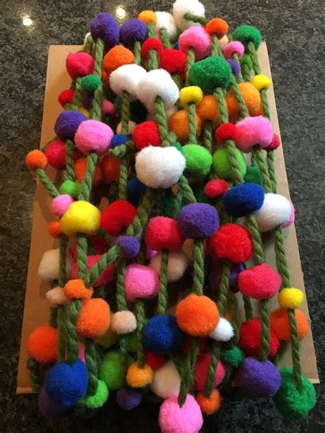 Pom pom garland for the Christmas tree. Dollar store pom poms and thick yarn. | Crafts, Pom pom ...