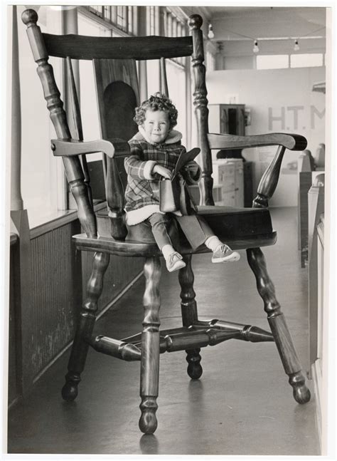 Child on oversized chair, Canterbury Furniture Show | discoverywall.nz