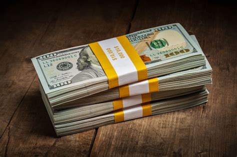 Premium Photo | Stacks of 100 dollars banknotes bundles