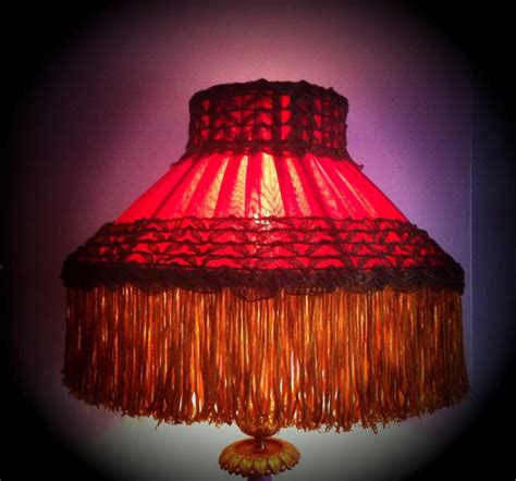 An 1880's restored English Victorian kerosene lampshade. A double red silk lining with a plumb ...