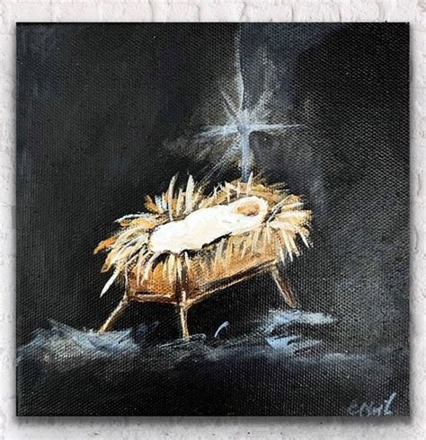 an oil painting of a baby jesus in the manger with a cross on it