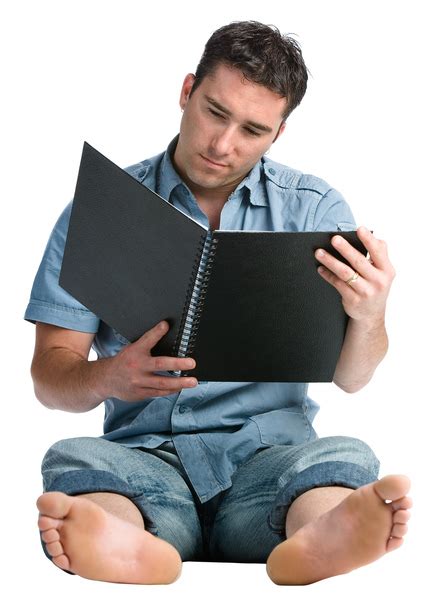 Barefoot man reading notebook Free Photo Download | FreeImages